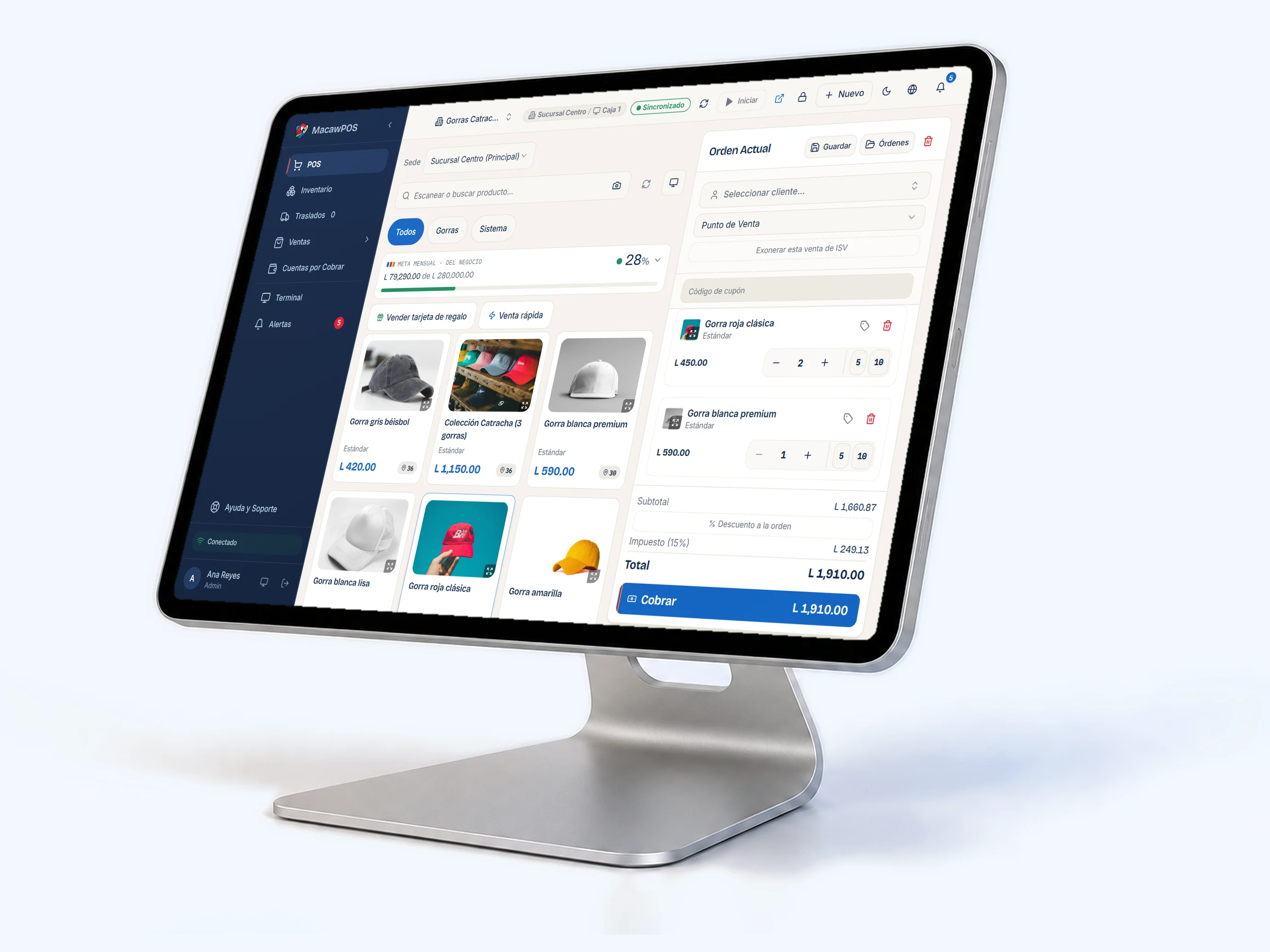 La caja de Macaw Suite en una tablet de mostrador, con tres gorras en la venta y el total con ISV.